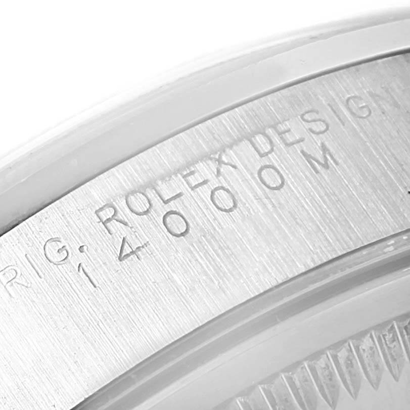 This close-up image shows the engraved details on the side of a Rolex Air-King 14000 Men's Stainless Steel Silver Dial 14000 Men's Stainless Steel Silver Dial model watch case.