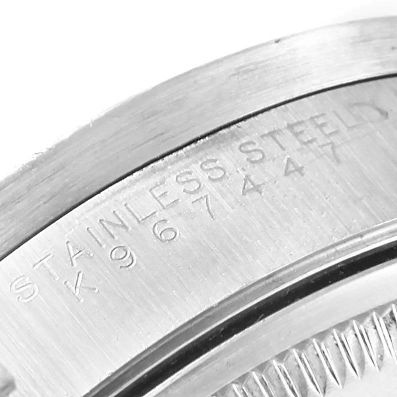 This close-up angle shows the engraved stainless steel case back of the Rolex Air-King 14010 Men's Stainless Steel Blue Dial 14010 Men's Stainless Steel Blue Dial watch.