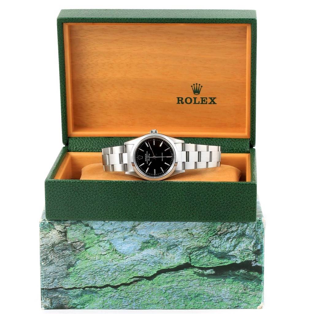 The Rolex Air-King 14000 Men's Stainless Steel Black Dial 14000 Men's Stainless Steel Black Dial watch is displayed frontally inside an open Rolex box, showing the face and bracelet.