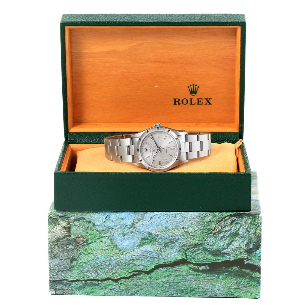 The image displays a Rolex Air-King 14010 Men's Stainless Steel Silver Dial 14010 Men's Stainless Steel Silver Dial watch placed inside an open green and wooden box, viewed from the front.