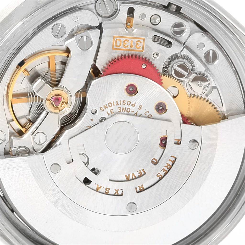 This close-up image shows the intricate mechanical movement inside a Rolex Air-King 14010 Men's Stainless Steel Silver Dial 14010 Men's Stainless Steel Silver Dial watch.