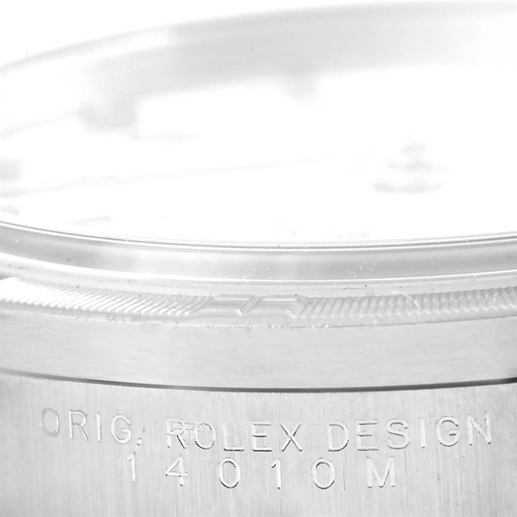 This image shows a close-up view of the bezel and side case of a Rolex Air-King 14010 Men's Stainless Steel White Dial 14010 Men's Stainless Steel White Dial watch, featuring the engraved model number 14010M.