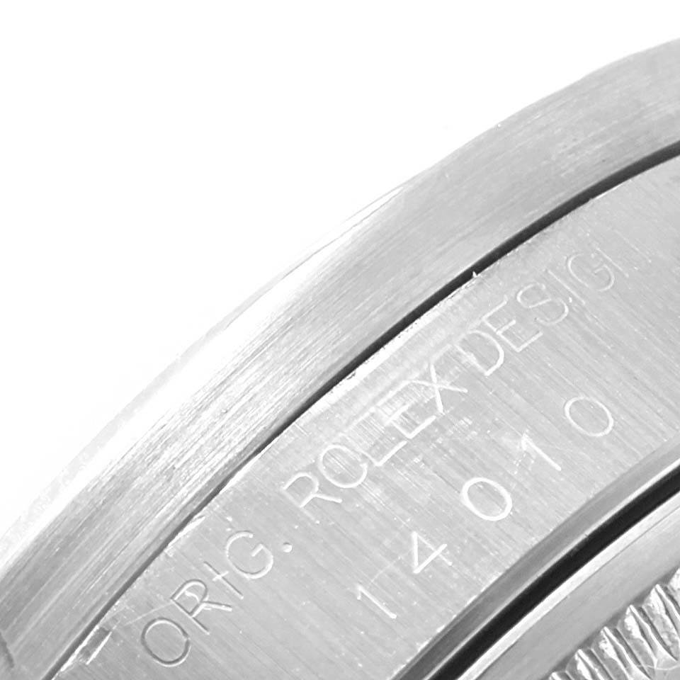 This image shows a close-up of the case side and engraved design number of a Rolex Air-King 14010 Men's Stainless Steel Blue Dial 14010 Men's Stainless Steel Blue Dial watch.