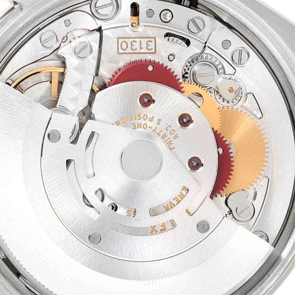 This image shows a close-up view of the internal mechanism of a Rolex Air-King 114234 Men's Stainless Steel Blue Dial 114234 Men's Stainless Steel Blue Dial watch, highlighting gears and components.