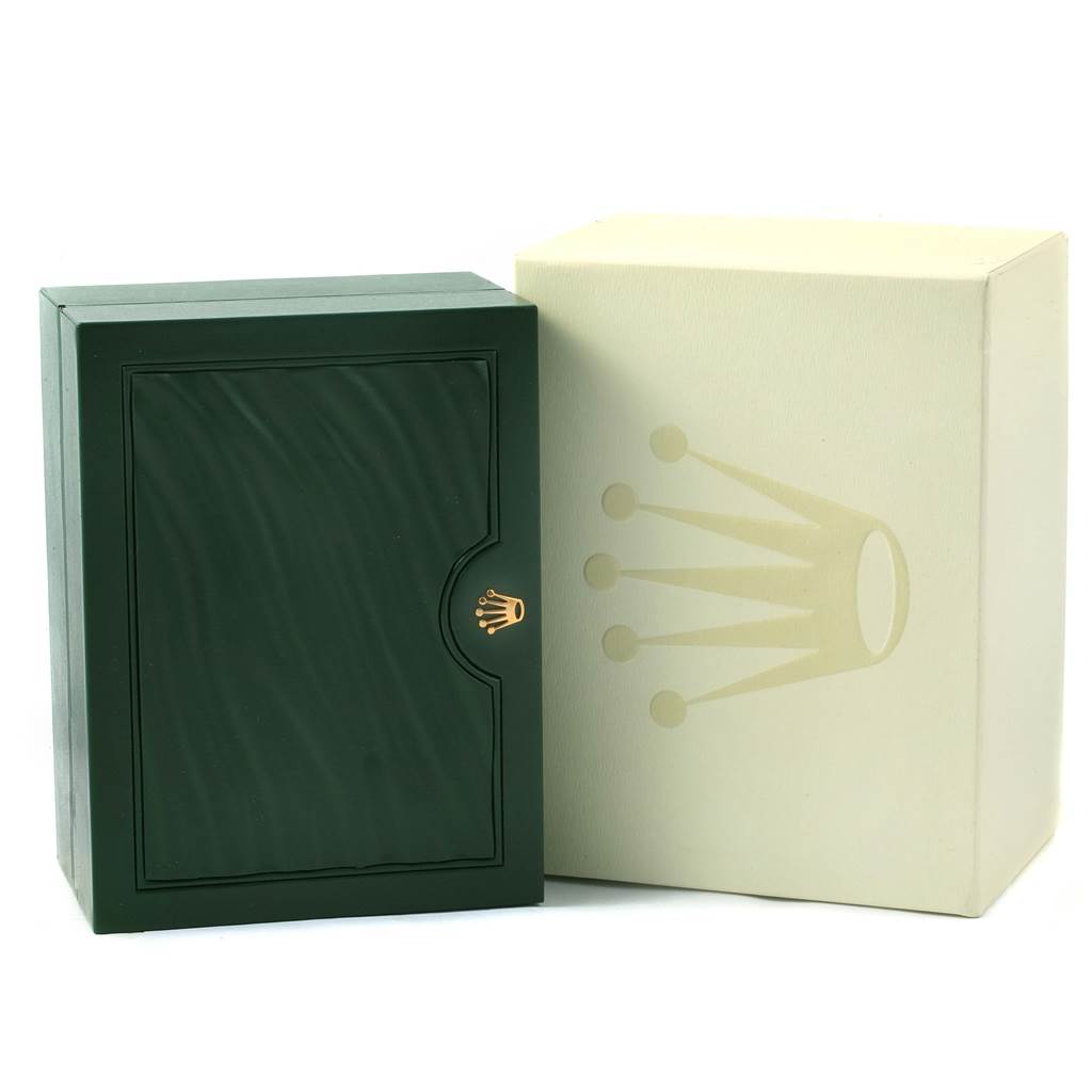 The image shows the packaging for a Rolex Air-King 114234 Men's Stainless Steel Blue Dial 114234 Men's Stainless Steel Blue Dial watch, including a beige outer box and a green inner box with a gold logo.