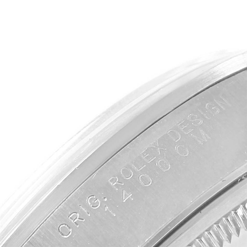 This image shows a close-up angle of a portion of the case back and the engraved details of a Rolex Air-King 14000 Men's Stainless Steel Blue Dial 14000 Men's Stainless Steel Blue Dial watch.
