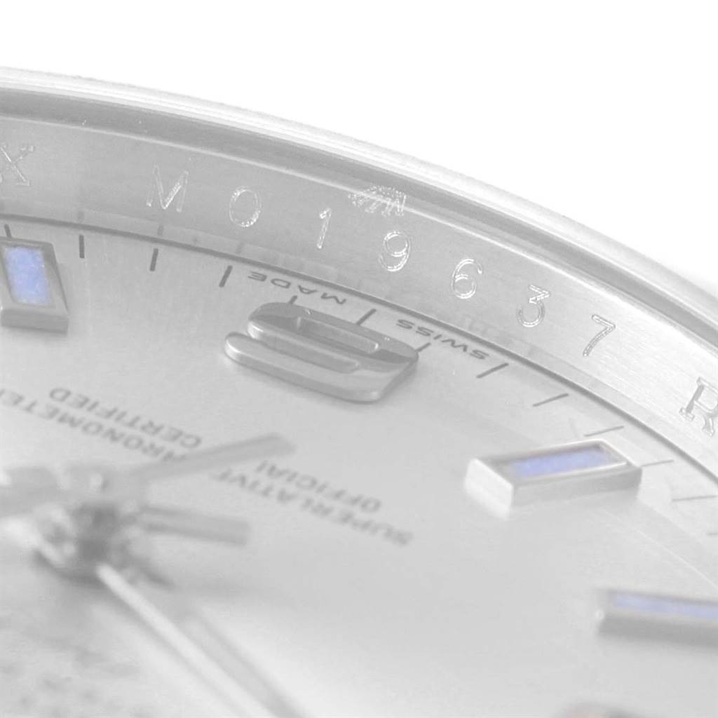 Close-up view of the Rolex Air-King 114200 Stainless Steel Silver Dial 114200 Stainless Steel Silver Dial watch showing part of the dial and the rehaut with the serial number engraved.