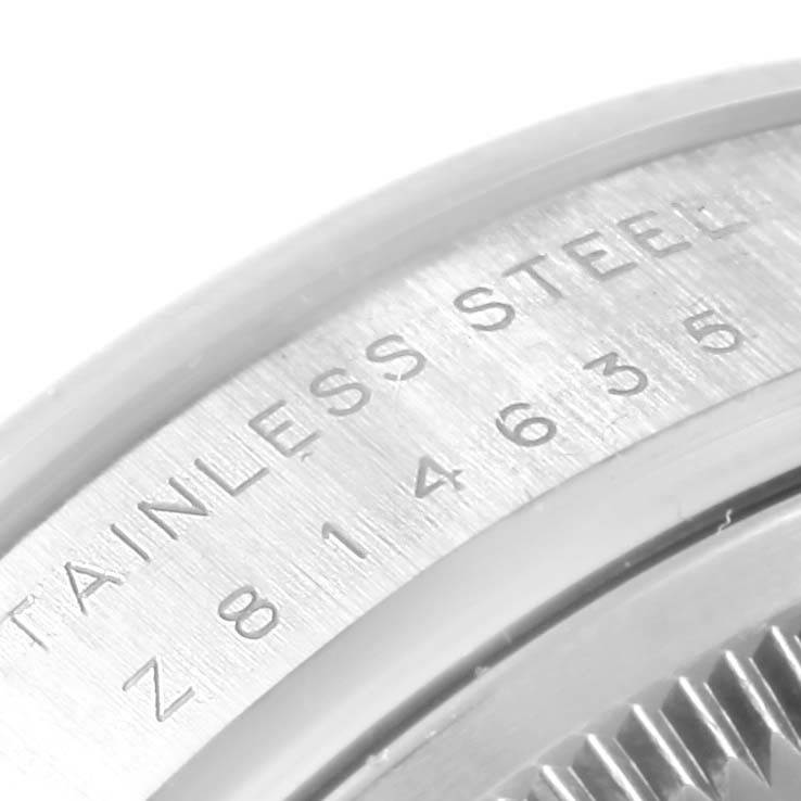 The image shows a close-up of the stainless steel casing and part of the bezel on a Rolex Air-King 114200 Men's Stainless Steel White Dial 114200 Men's Stainless Steel White Dial model.