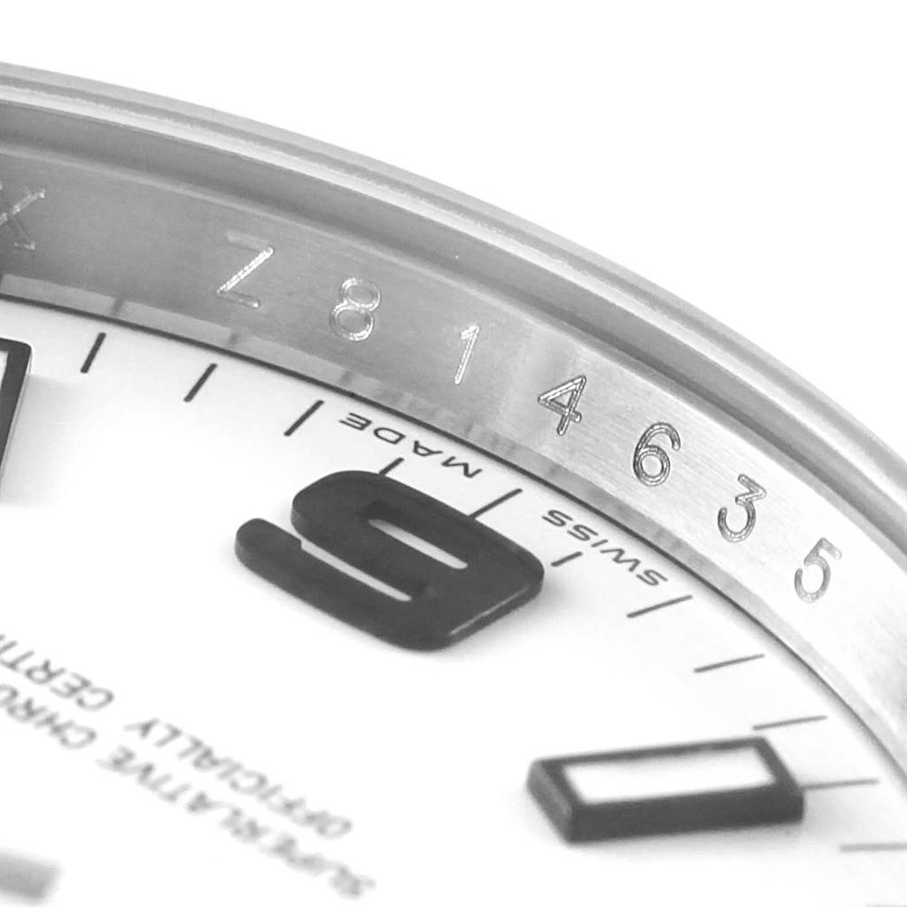 This close-up image shows the bezel and part of the dial of a Rolex Air-King 114200 Men's Stainless Steel White Dial 114200 Men's Stainless Steel White Dial watch, focusing on the numerals.