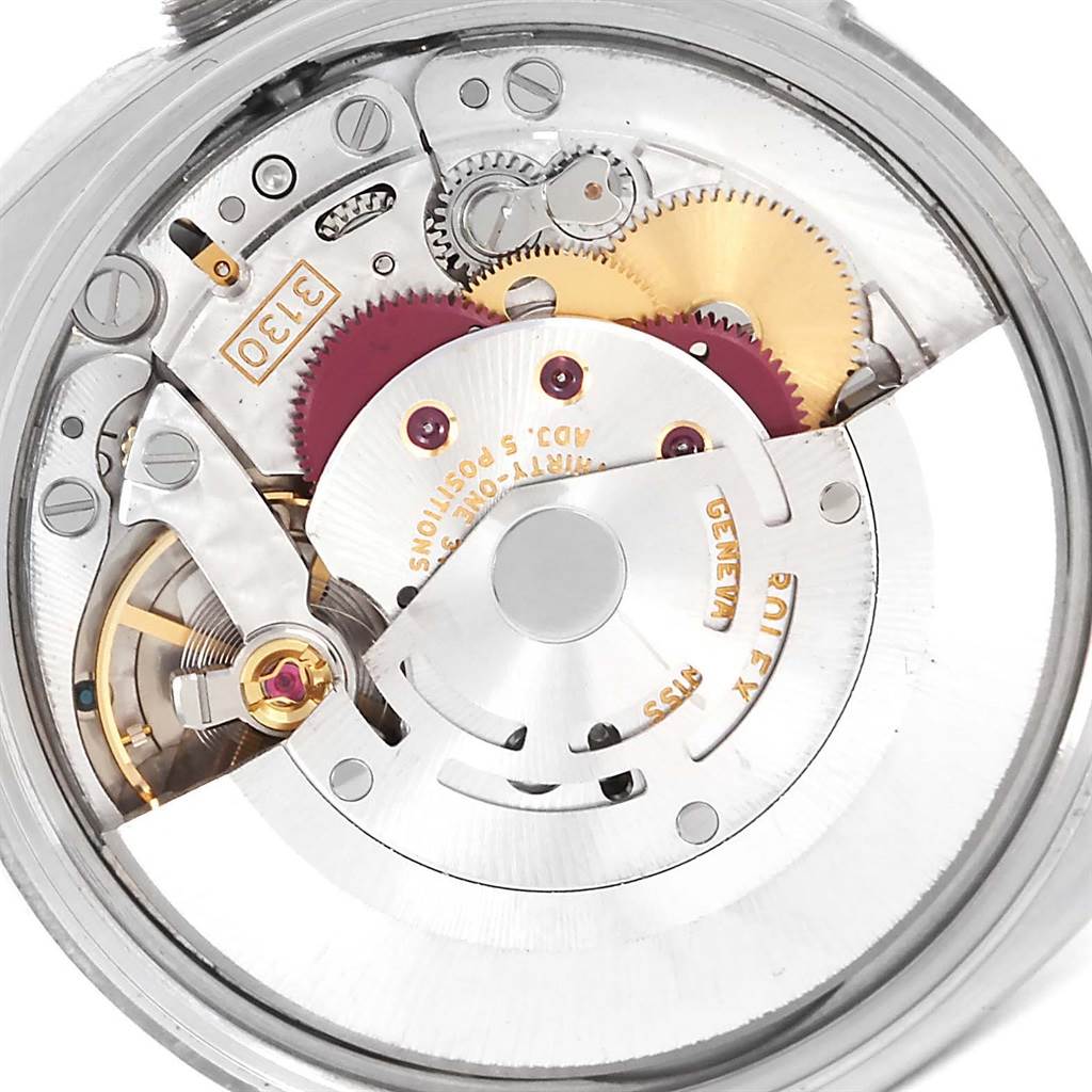 This image shows the internal mechanical movement of a Rolex Air-King 114200 Men's Stainless Steel White Dial 114200 Men's Stainless Steel White Dial watch, showcasing gears and parts from a close-up angle.