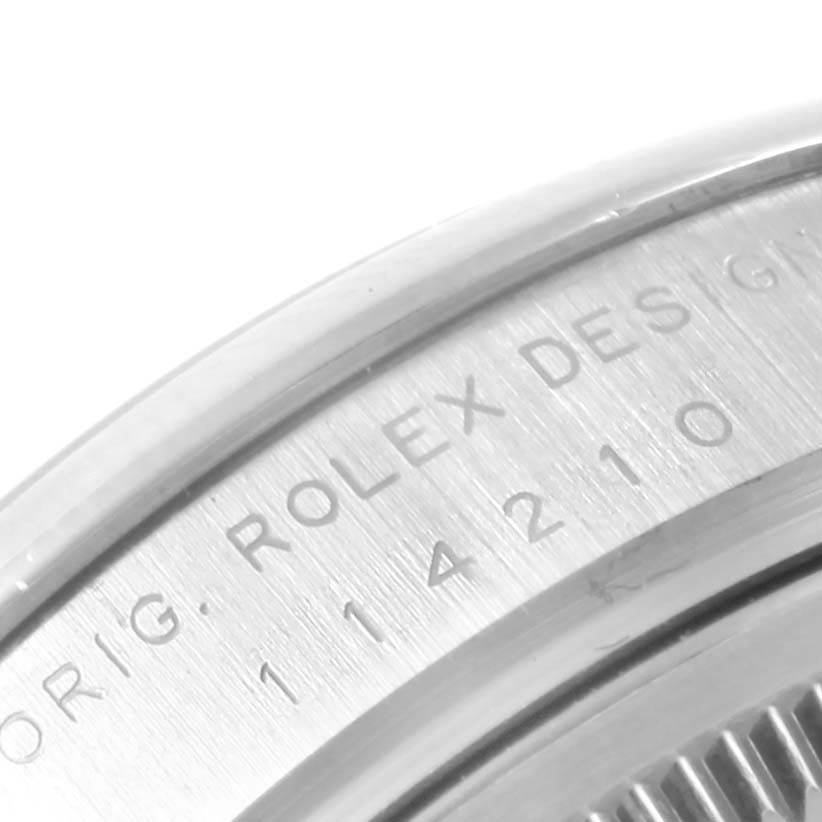 This image shows a close-up of the engraved case-back rim of a Rolex Air-King 114200 Men's Stainless Steel White Dial 114200 Men's Stainless Steel White Dial watch.