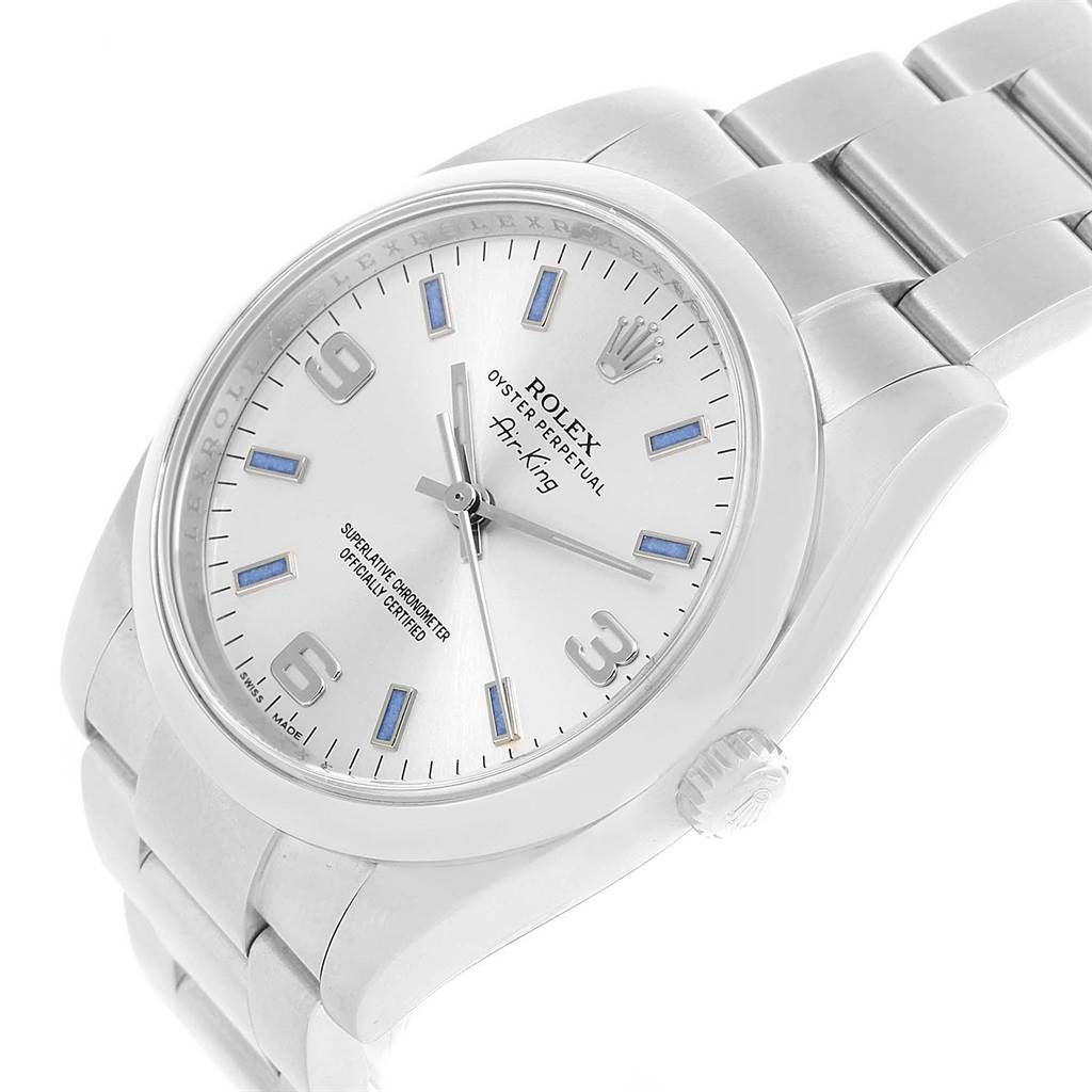 The Rolex Air-King 114200 Men's Stainless Steel Silver Dial 114200 Men's Stainless Steel Silver Dial watch is shown at an angled view, highlighting the face, crown, and part of the stainless steel bracelet.