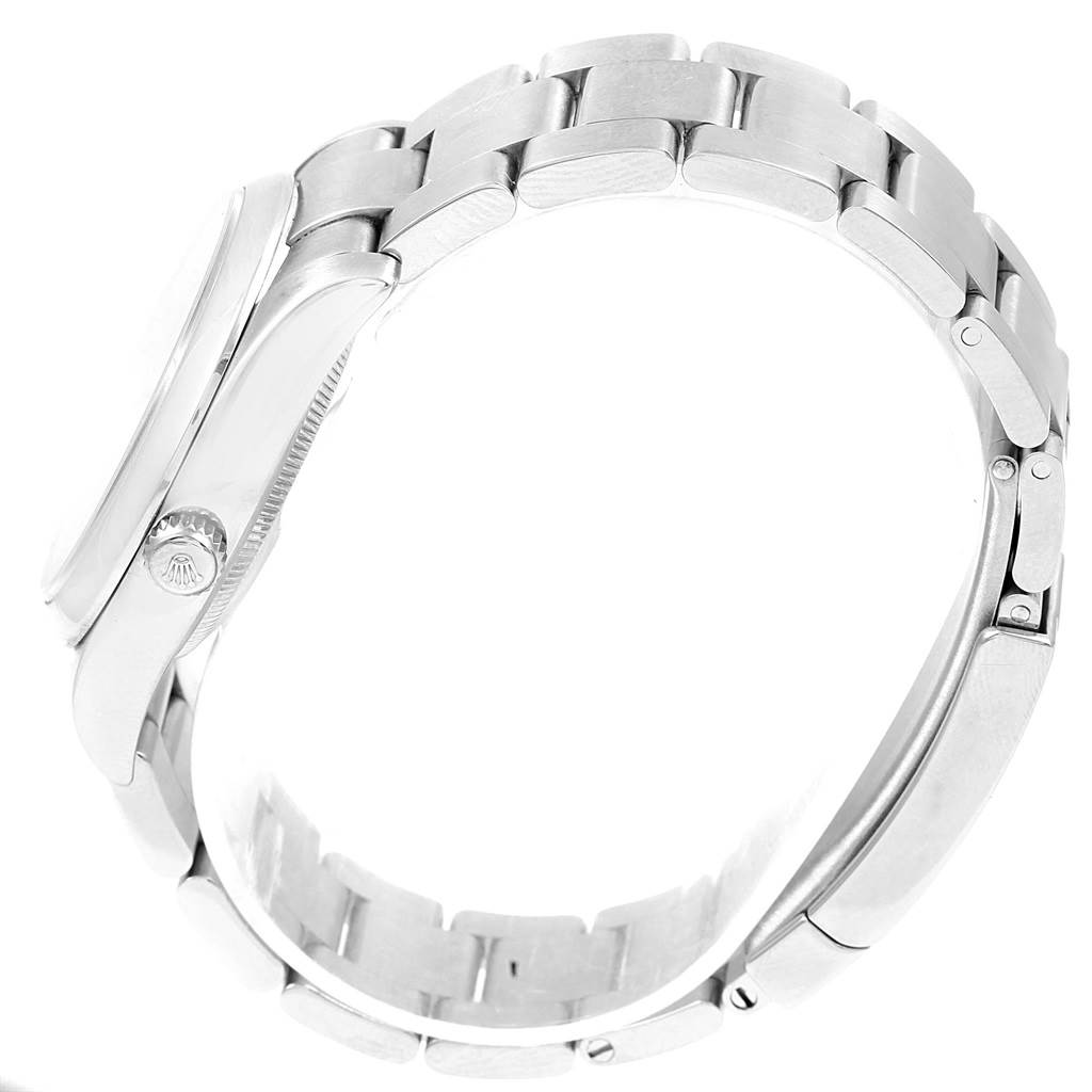 Side view of a Rolex Air-King 114200 Men's Stainless Steel Silver Dial 114200 Men's Stainless Steel Silver Dial watch showing the crown, case, and bracelet links.