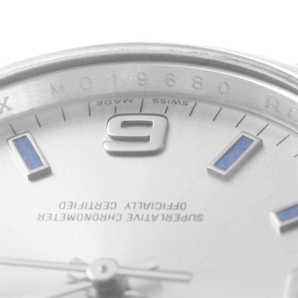 The image shows a close-up of the dial of a Rolex Air-King 114200 Men's Stainless Steel Silver Dial 114200 Men's Stainless Steel Silver Dial watch, highlighting the 9 o'clock marker and part of the dial text.