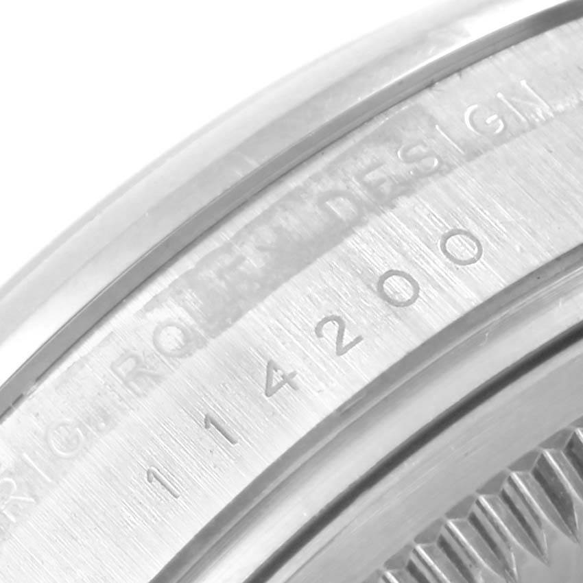 A close-up of the Rolex Air-King 114200 Men's Stainless Steel Silver Dial 114200 Men's Stainless Steel Silver Dial model shows the engraved model number on the metal part of the case.