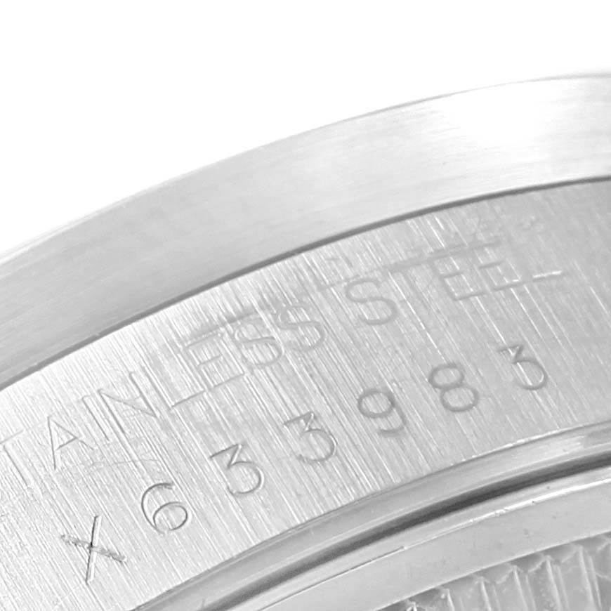 The image shows a close-up of the stainless steel back casing of a Rolex Air-King 14010 Men's Stainless Steel White Dial 14010 Men's Stainless Steel White Dial watch, highlighting the serial number engraving.