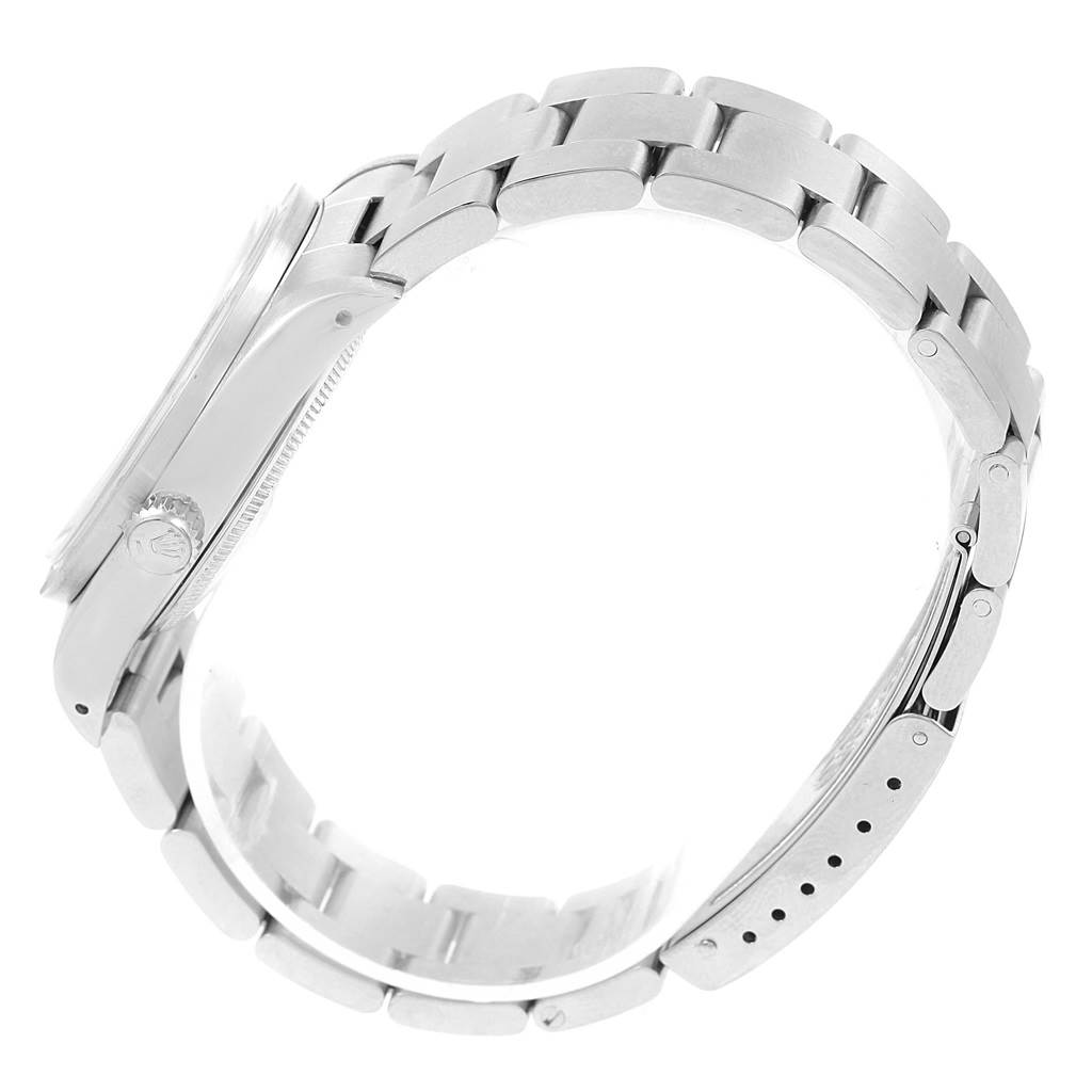 This side view of the Rolex Air-King 14010 Men's Stainless Steel White Dial 14010 Men's Stainless Steel White Dial watch displays the band, bezel, and crown.