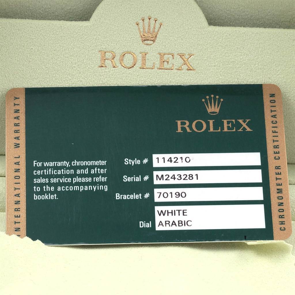 This image shows the warranty card for a Rolex Air-King 114210 Men's Stainless Steel White Dial 114210 Men's Stainless Steel White Dial watch, including its style, serial, and bracelet numbers, and dial type.