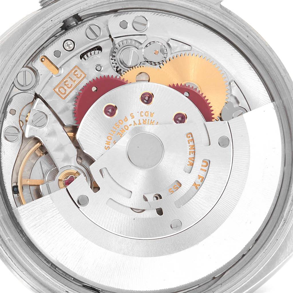 This image shows the internal mechanical movement of a Rolex Air-King 114210 Men's Stainless Steel White Dial 114210 Men's Stainless Steel White Dial watch, highlighting gears and intricate components.