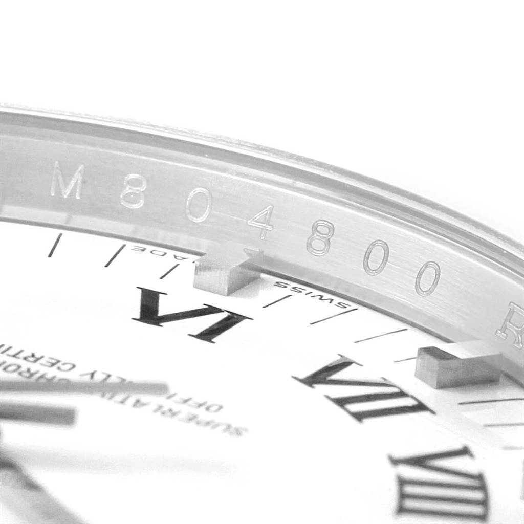 The image shows a close-up angle of the Rolex Air-King 114200 Men's Stainless Steel White Dial 114200 Men's Stainless Steel White Dial watch dial, focusing on the Roman numerals and serial number.