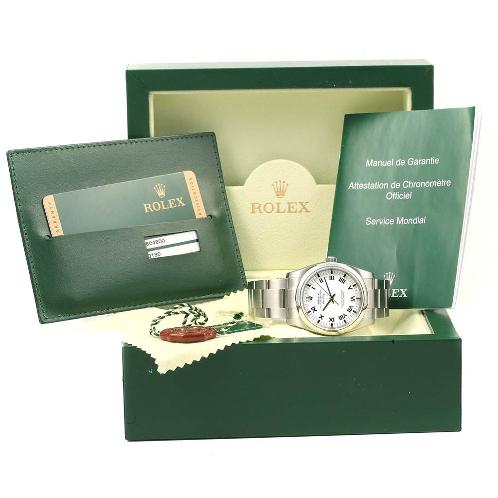 This image shows a Rolex Air-King 114200 Men's Stainless Steel White Dial 114200 Men's Stainless Steel White Dial watch, warranty card, manual, box, and additional tags and accessories.