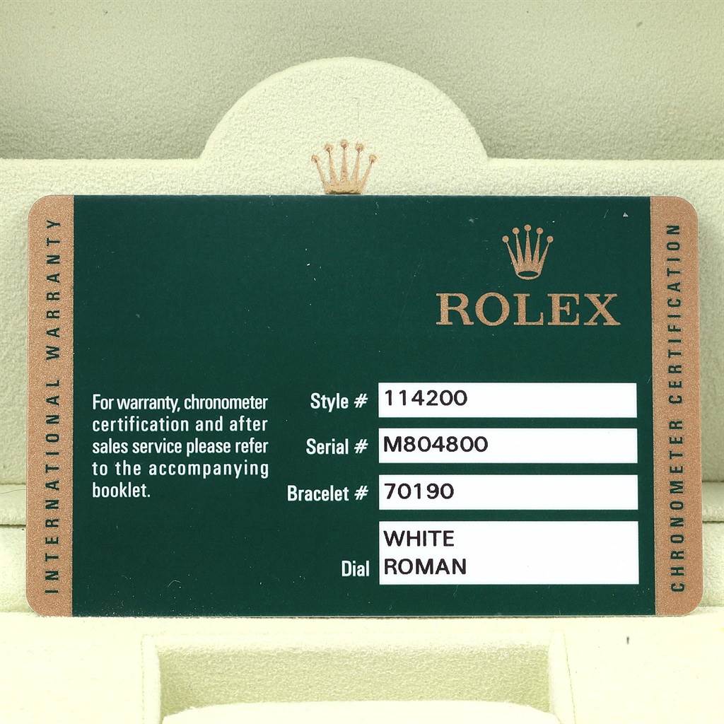 This image shows the warranty card for a Rolex Air-King 114200 Men's Stainless Steel White Dial 114200 Men's Stainless Steel White Dial watch, detailing the style, serial, and bracelet numbers, and dial type.