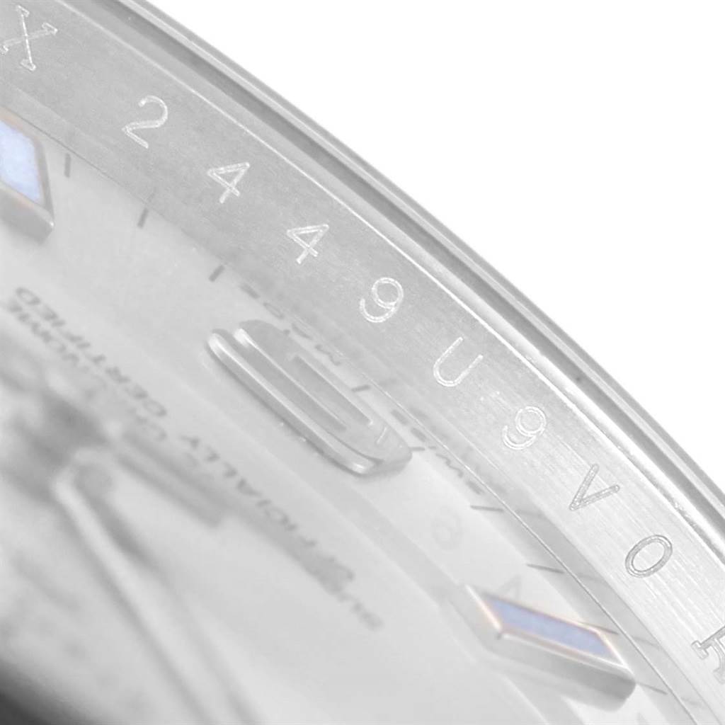 This image shows a close-up of the bezel and part of the dial of a Rolex Air-King 114200 Stainless Steel Silver Dial 114200 Stainless Steel Silver Dial watch, featuring engravings and markers.
