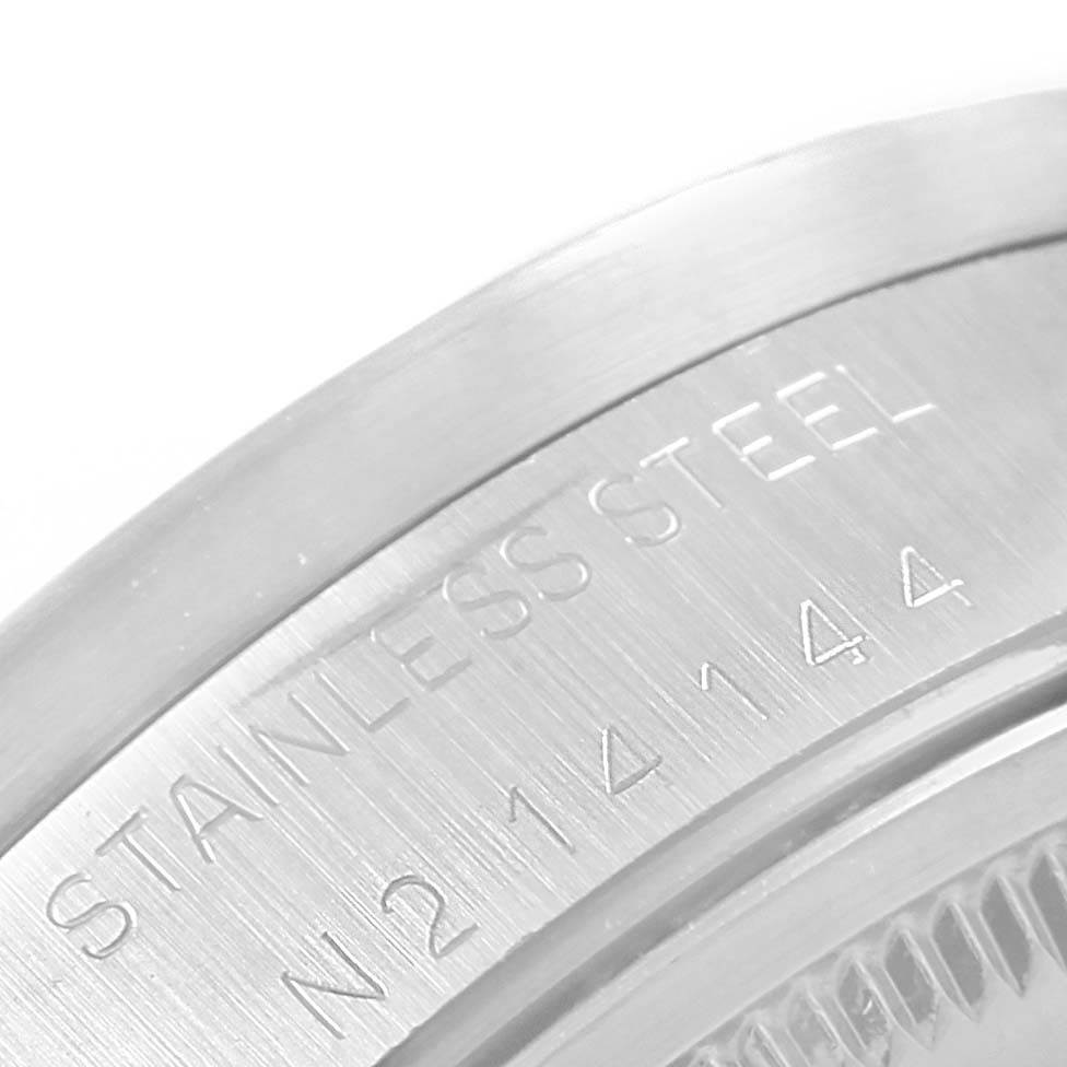 This image shows a close-up of the stainless steel case back with engravings on a Rolex Air-King 14010 Men's Stainless Steel Blue Dial 14010 Men's Stainless Steel Blue Dial watch.