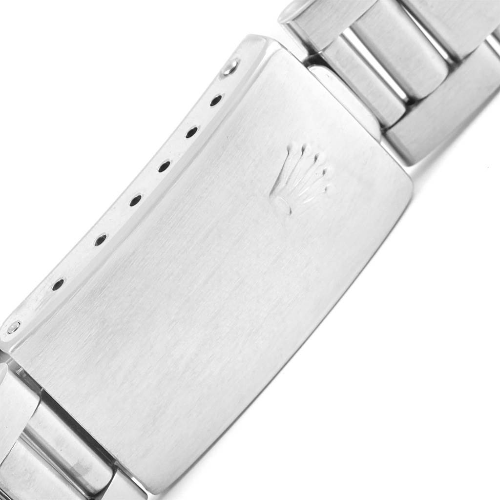 This is a close-up view of the clasp of a Rolex Air-King 14010 Men's Stainless Steel Blue Dial 14010 Men's Stainless Steel Blue Dial watch, showcasing the logo and bracelet links.