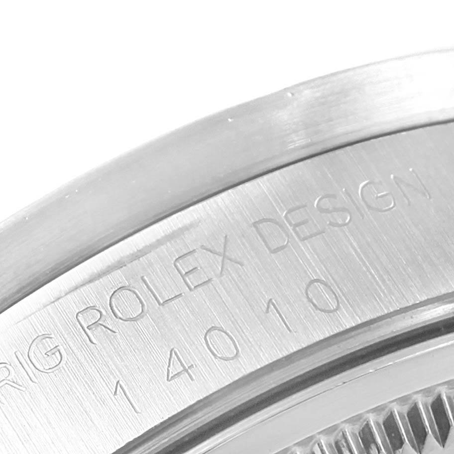 The image shows a close-up of the case back rim of the Rolex Air-King 14010 Men's Stainless Steel Blue Dial 14010 Men's Stainless Steel Blue Dial watch engraved with "ORIG ROLEX DESIGN 14010".