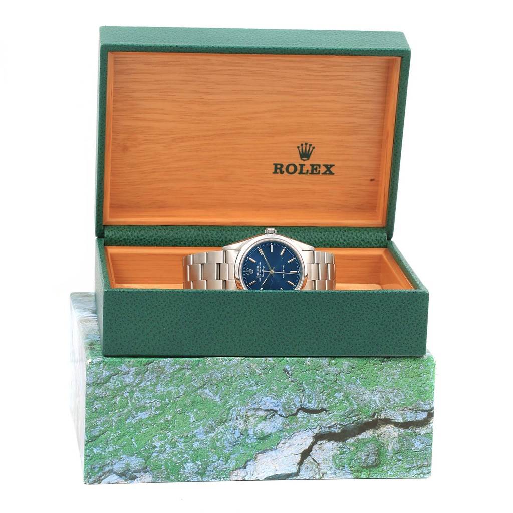 The Rolex Air-King 14000 Stainless Steel Blue Dial 14000 Stainless Steel Blue Dial watch is displayed front-facing in an open green and wooden box.