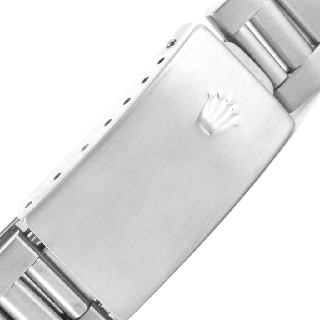 This image shows a close-up of the clasp of a Rolex Air-King 14000 Stainless Steel Blue Dial 14000 Stainless Steel Blue Dial watch bracelet, featuring the Rolex crown logo.