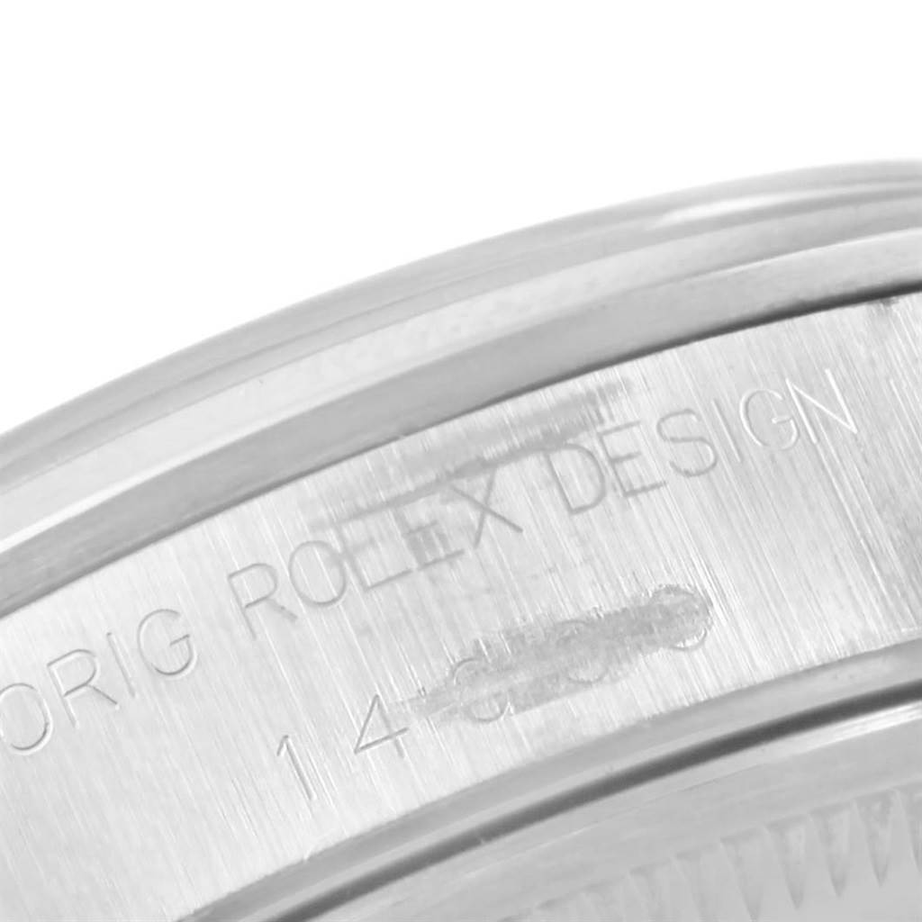 This image shows an extreme close-up of the side casing of a Rolex Air-King 14000 Stainless Steel Blue Dial 14000 Stainless Steel Blue Dial, highlighting its engraved text.
