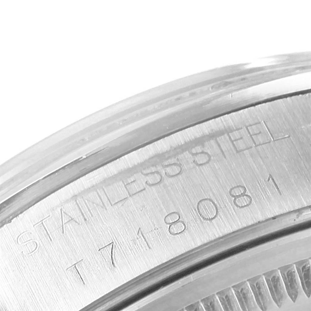 The image shows a close-up of the stainless steel case back of a Rolex Air-King 14000 Stainless Steel Pink Dial 14000 Stainless Steel Pink Dial model, displaying engraved text and the serial number.