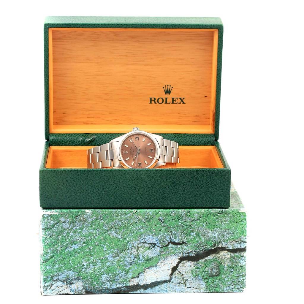The image shows a Rolex Air-King 14000 Stainless Steel Pink Dial 14000 Stainless Steel Pink Dial watch from a front angle, inside an open green and wood-textured Rolex box.