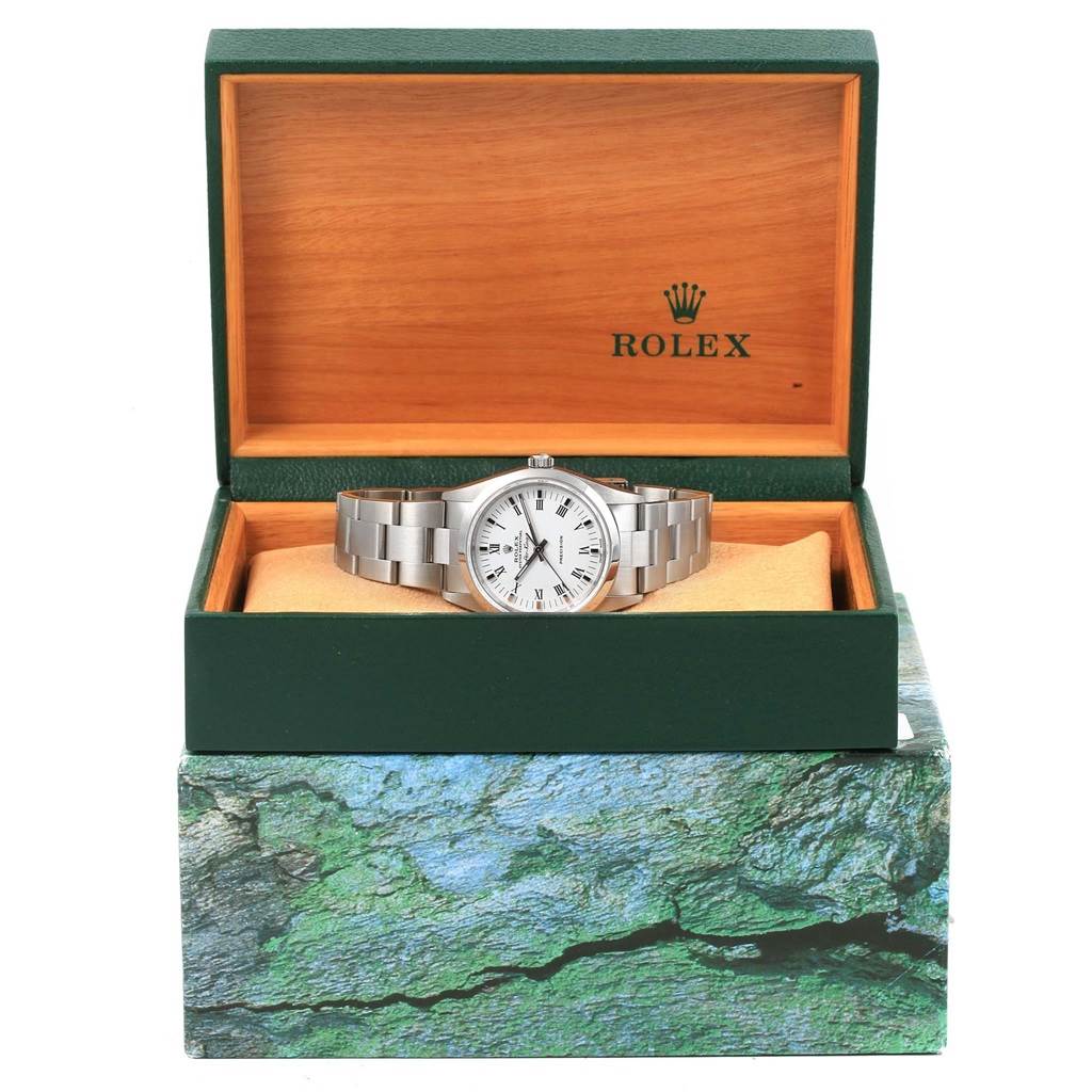 The Rolex Air-King 14000 Stainless Steel White Dial 14000 Stainless Steel White Dial watch is displayed front-facing in an open green and wooden Rolex box.