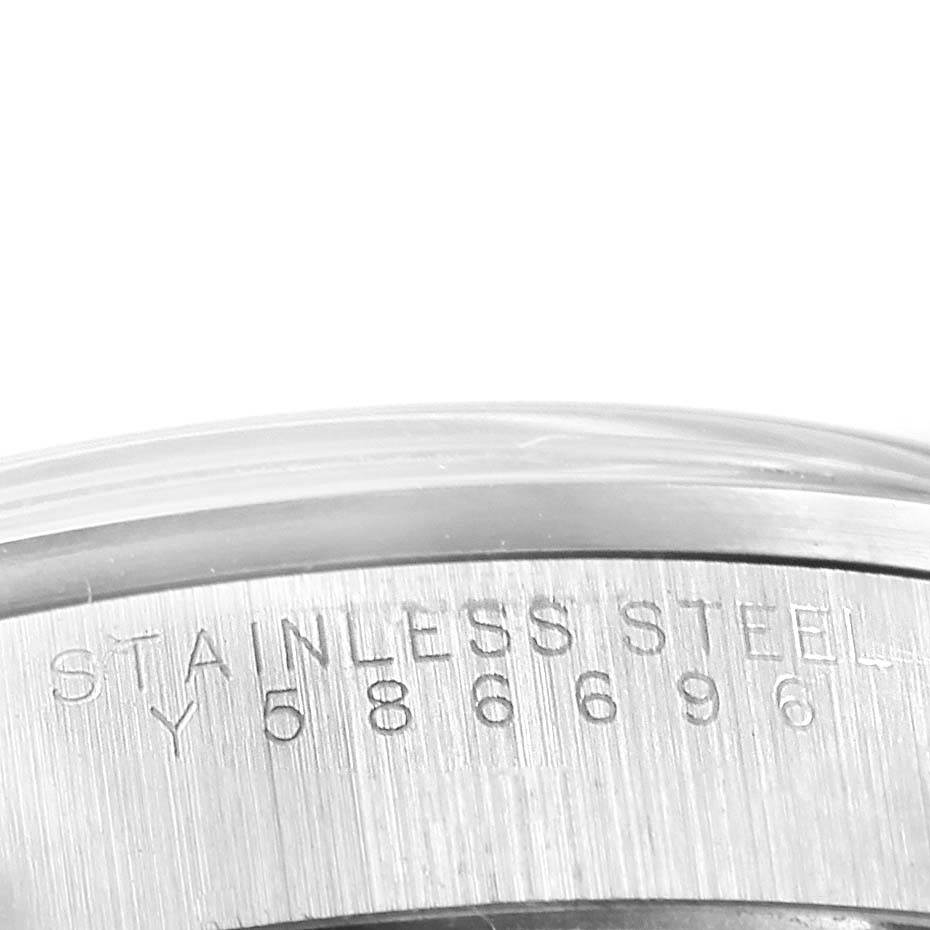 This close-up image shows the stainless steel casing with a partial view of the engraving on the Rolex Air-King 14000 Stainless Steel White Dial 14000 Stainless Steel White Dial watch.