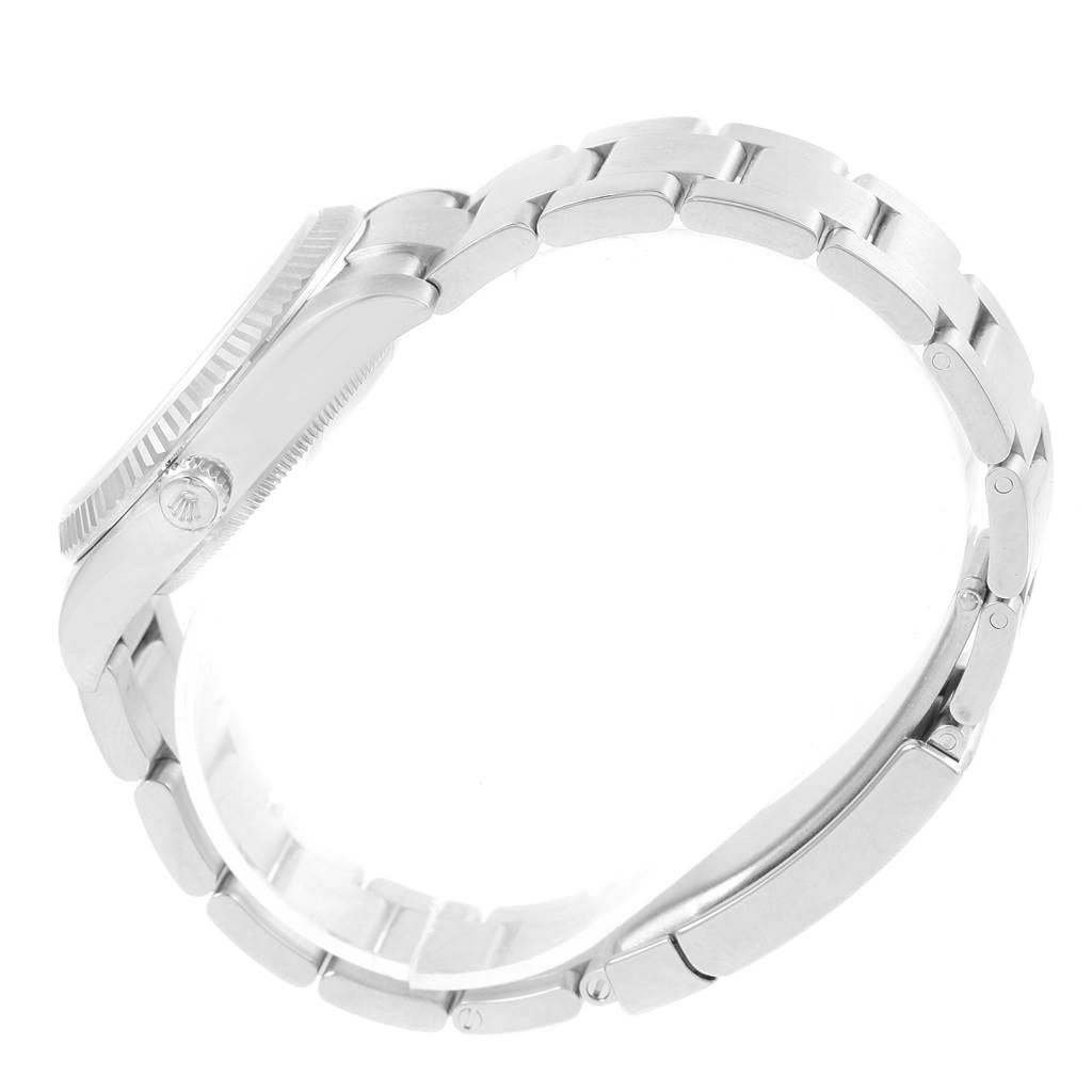 This image shows a side view of the Rolex Air-King 114234 Stainless Steel Silver Dial 114234 Stainless Steel Silver Dial watch, highlighting the case, crown, and part of the bracelet.