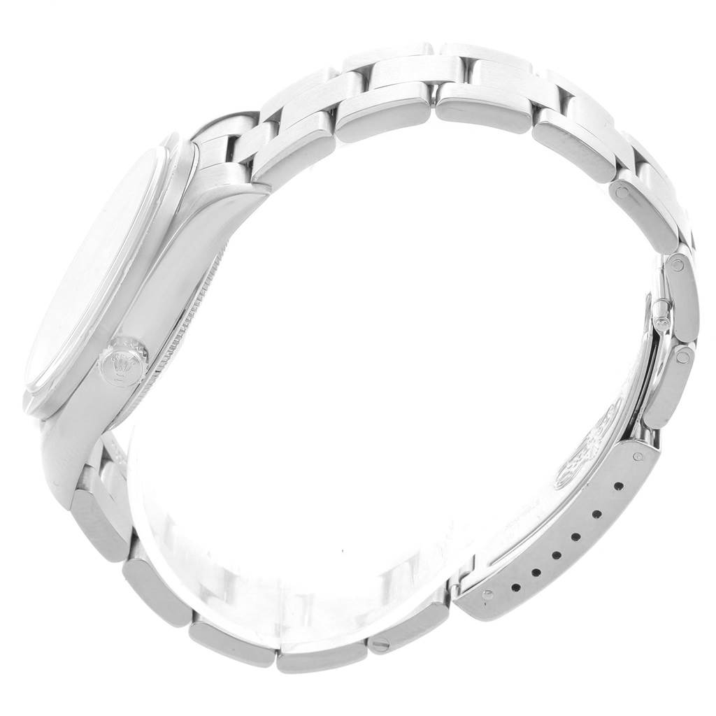 The image shows a side view of the Rolex Air-King 14010 Men's Stainless Steel Pink Dial 14010 Men's Stainless Steel Pink Dial watch, highlighting its bracelet and clasp.