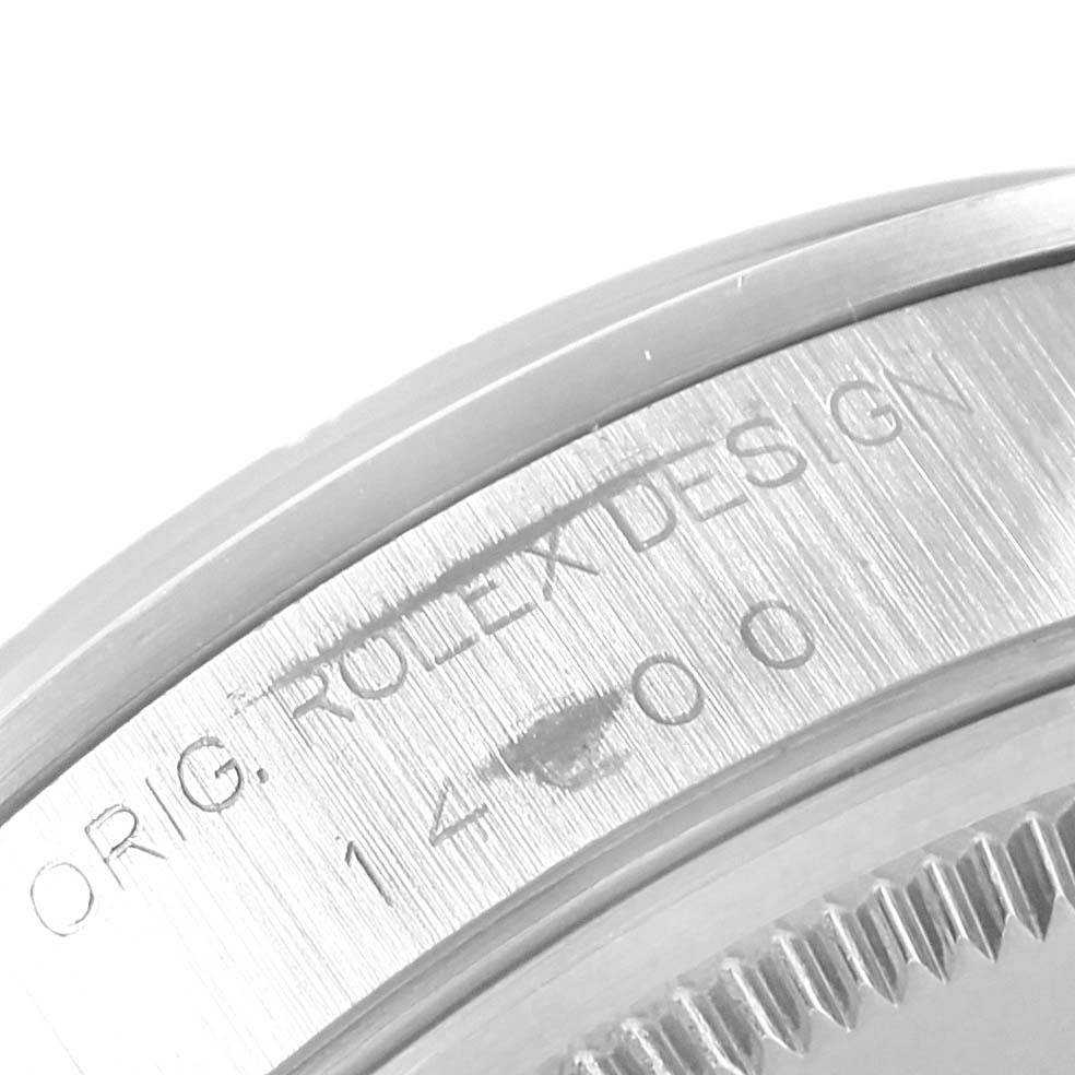 The image shows a close-up angle of the bezel and engraved side of a Rolex Air-King 14000 Men's Stainless Steel Silver Dial 14000 Men's Stainless Steel Silver Dial watch.