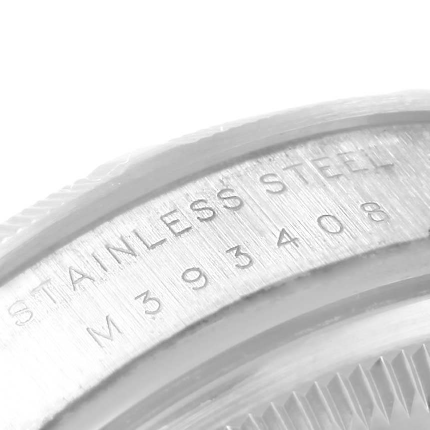This image shows a close-up of the stainless steel case back with engravings of the Rolex Air-King 114210 Stainless Steel Silver Dial 114210 Stainless Steel Silver Dial model.