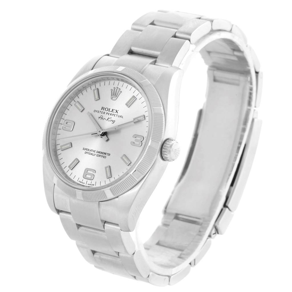 The Rolex Air-King 114210 Stainless Steel Silver Dial 114210 Stainless Steel Silver Dial watch is shown at an angled side view, displaying its face, bezel, crown, and bracelet.