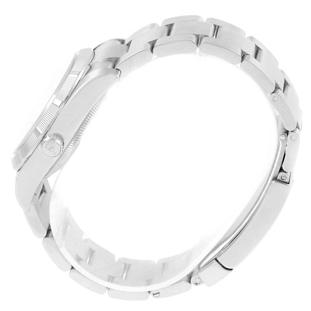 The image shows a side view of the Rolex Air-King 114210 Stainless Steel Silver Dial 114210 Stainless Steel Silver Dial watch, focusing on the band, case, and crown.