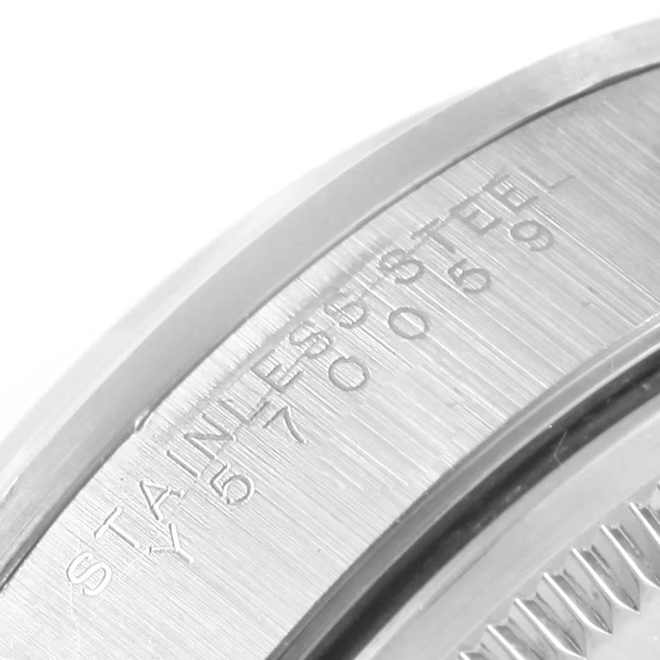 The image shows a close-up angle of the side casing of the Rolex Air-King 14000 Stainless Steel Black Dial 14000 Stainless Steel Black Dial watch, featuring its engraved details.