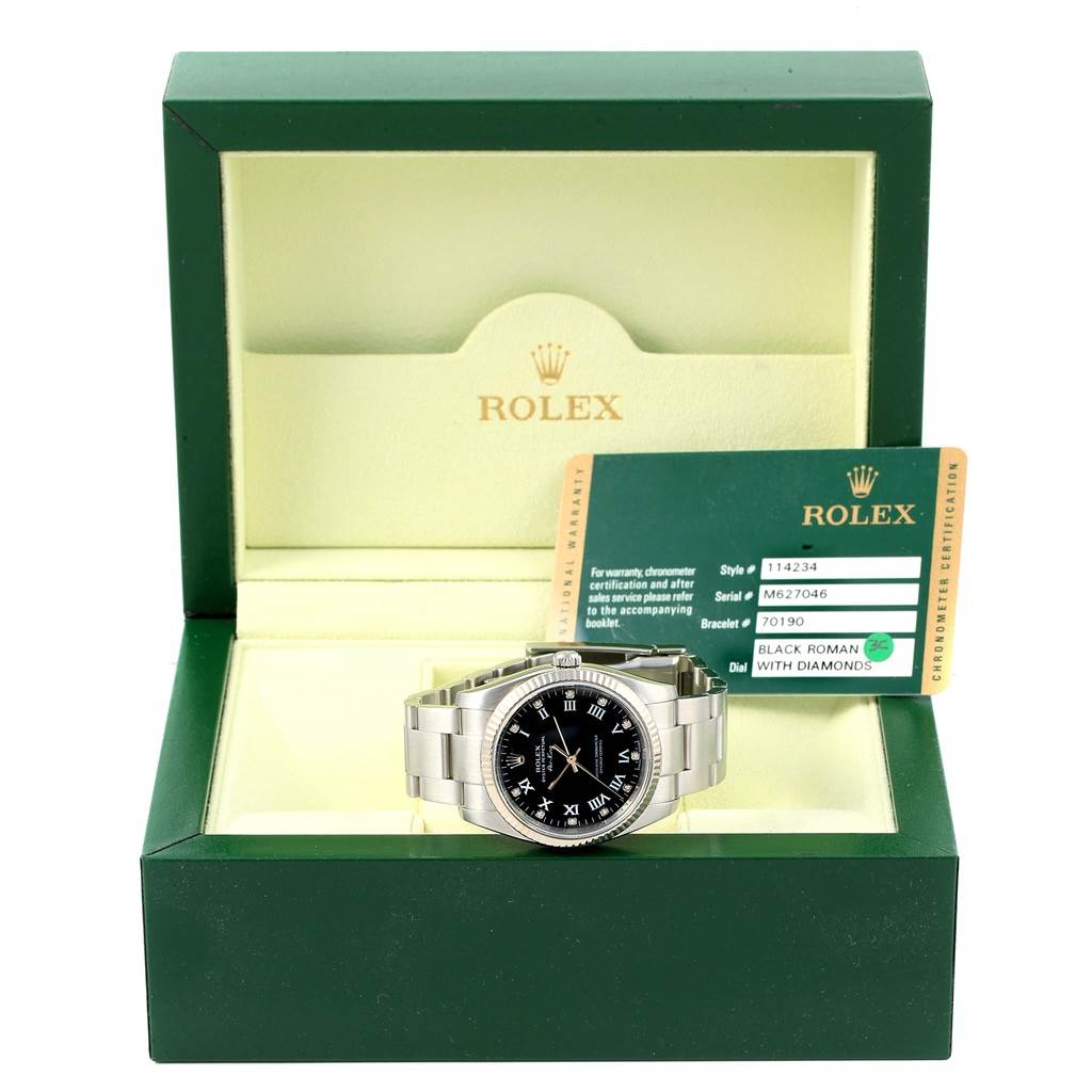 The image shows a Rolex Air-King 114234 Men's Stainless Steel Black Dial 114234 Men's Stainless Steel Black Dial model in its box at a front angle, with a warranty card placed beside it.