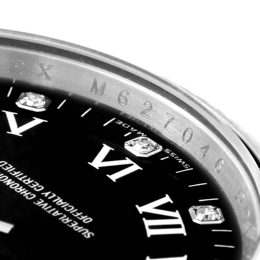 The image shows a close-up of the Rolex Air-King 114234 Men's Stainless Steel Black Dial 114234 Men's Stainless Steel Black Dial watch's dial and part of the bezel with its serial number.
