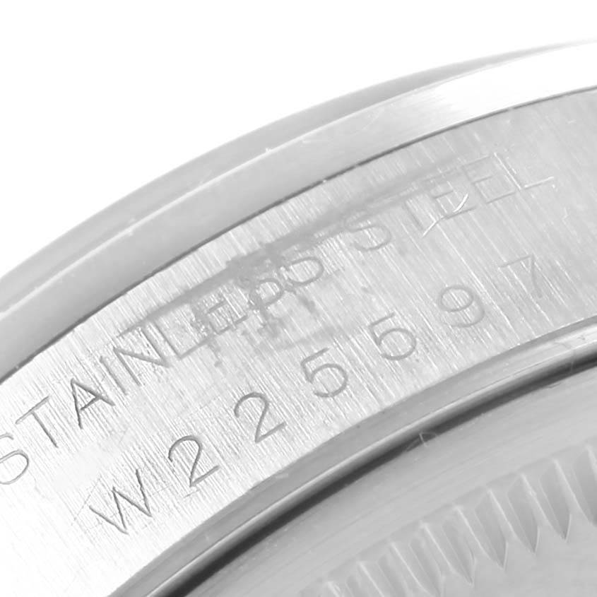 The image shows a close-up of the serial number and "STAINLESS STEEL" engraving on the case back edge of a Rolex Air-King 14000 Men's Stainless Steel Blue Dial 14000 Men's Stainless Steel Blue Dial watch.