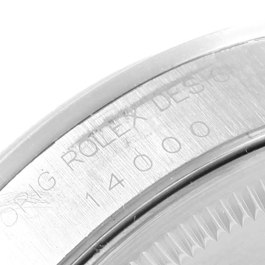 This close-up image shows the engraved edge of the case back of a Rolex Air-King 14000 Men's Stainless Steel Blue Dial 14000 Men's Stainless Steel Blue Dial watch.
