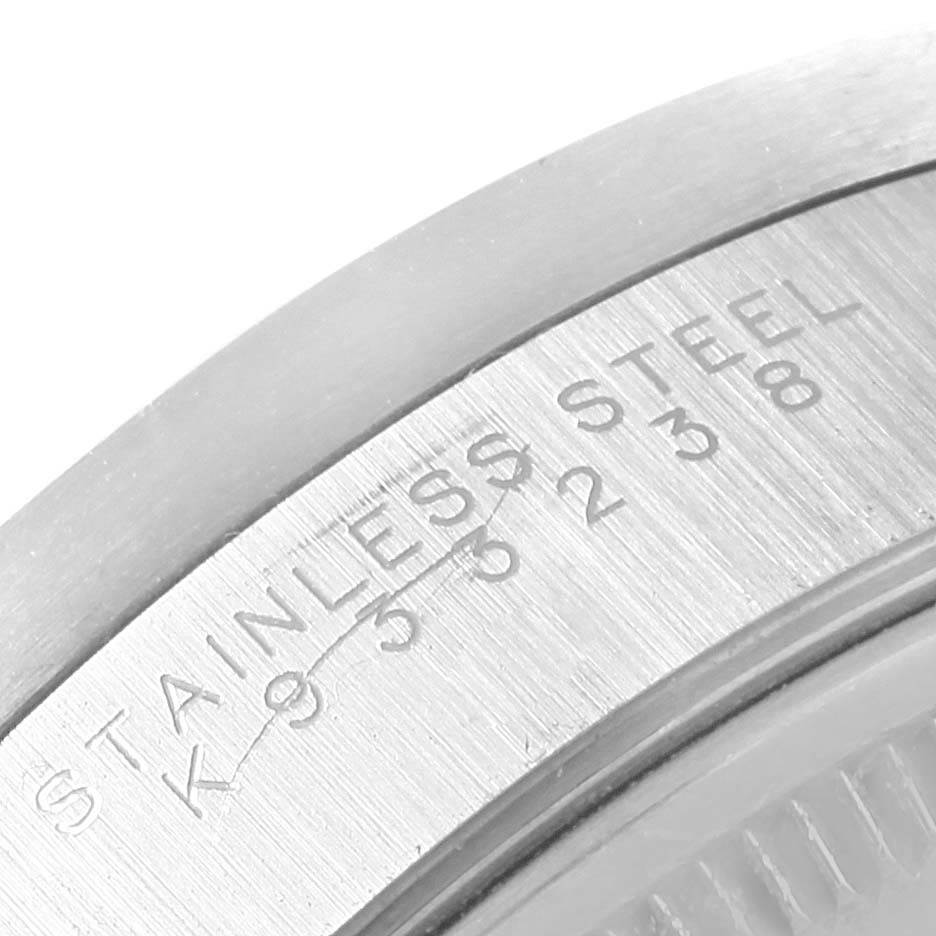 This image shows a close-up of the case back of the Rolex Air-King 14010 Men's Stainless Steel Black Dial 14010 Men's Stainless Steel Black Dial watch, highlighting the "STAINLESS STEEL" engraving.