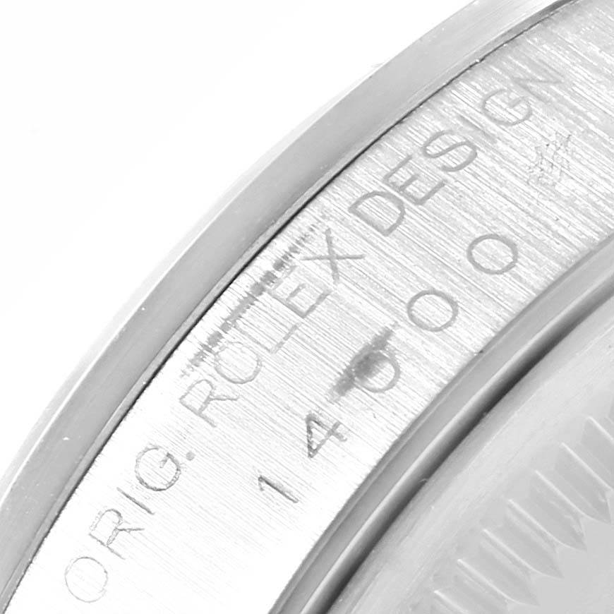 The image shows a close-up of the engraving on the side of the bezel of a Rolex Air-King 14000 Men's Stainless Steel Blue Dial 14000 Men's Stainless Steel Blue Dial watch.